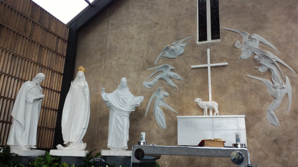 L to R: St. Joseph, Mother Mary, St. John the Evangelist, Agnus Dei, adoring angels